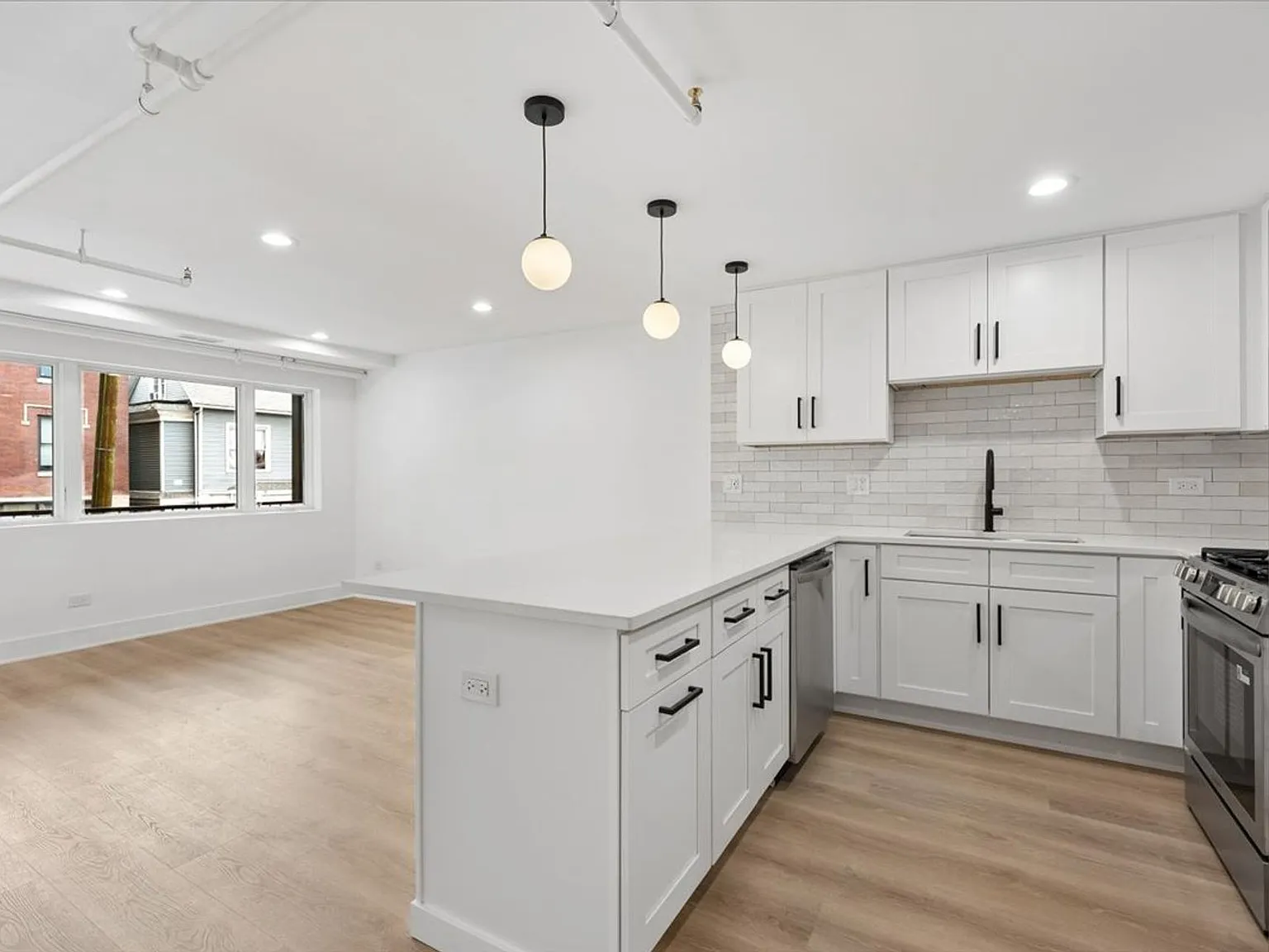 Bright Logan Square 2BR/2BA | Chef's Kitchen, In-Unit W/D, Balcony — Photo 3