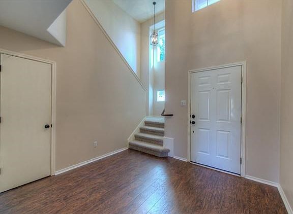 As you enter the home, you are greeted by a lovely foyer are