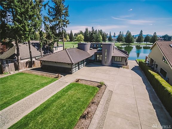 Welcome home to you own piece of paradise!  Located on amenity filled Tapps Island on Lake Tapps, this remarkable home offers beautiful lake, golf course and mountain views.  