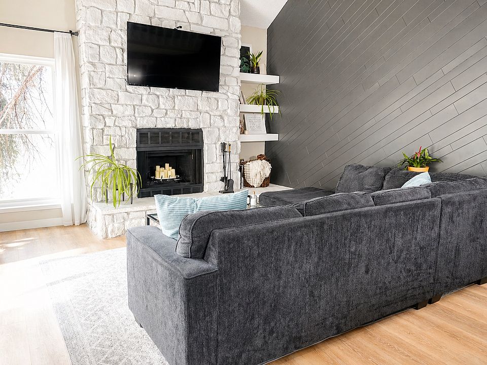 Vaulted ceilings and floor to ceiling stone fireplace