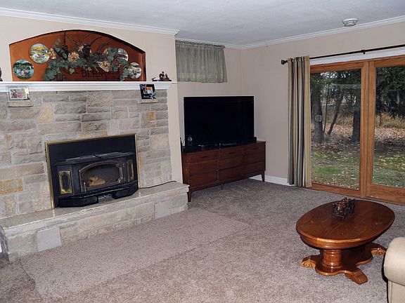 Wood burning fireplace with stone surround for relaxing