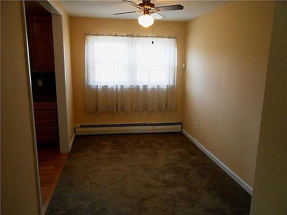 Spacious dining room with ceiling fan/light