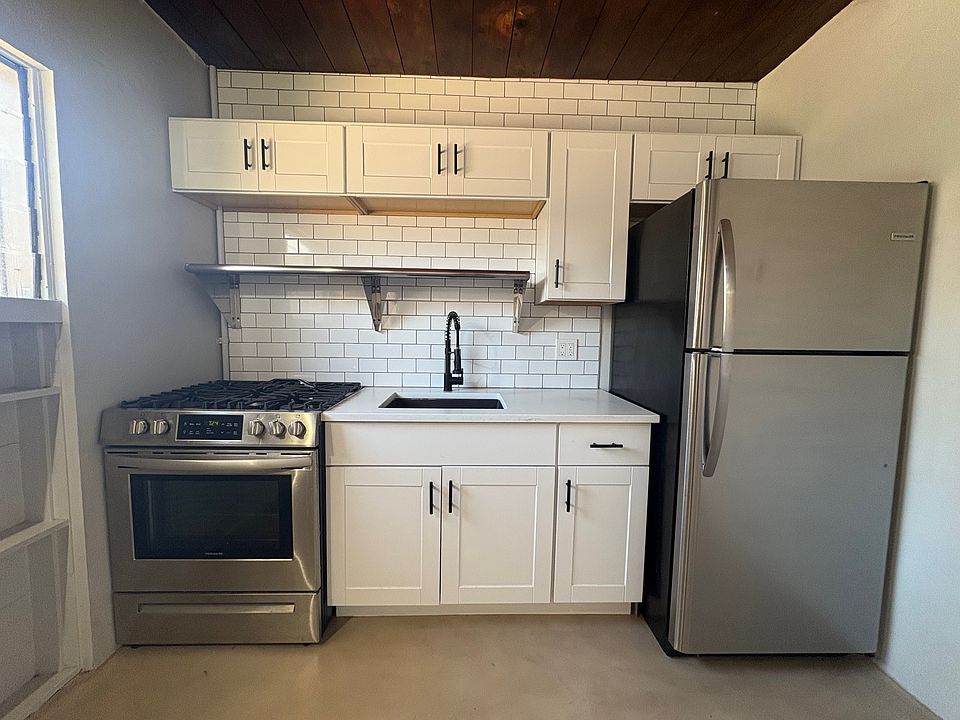 Kitchen with stainless steel appliances, gas range and subway tile