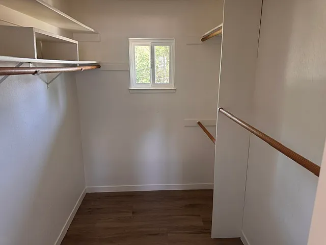 Primary bedroom walk-in closet