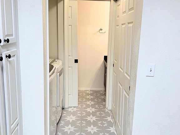 Entrance to the bathroom (located on the right side of the kitchen)