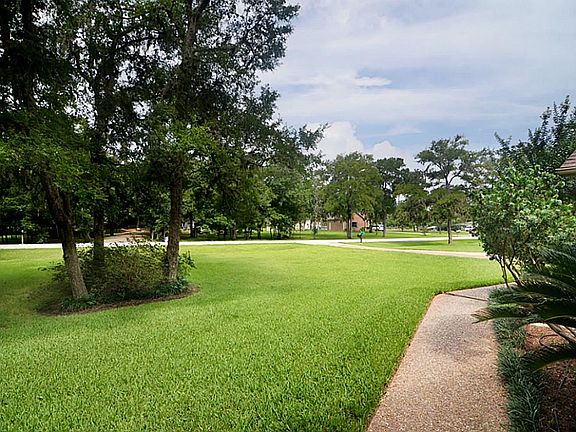 A quick glance back over your path and past your stately front yard, you'll get a glimpse of your peaceful neighborhood, aptly named "Pecan Estates".  Experience more of this wonderful property, and see many more photos, by taking the "virtual tour"!