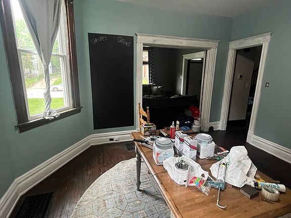 Furnished Dining Room with Chalk Board wall
