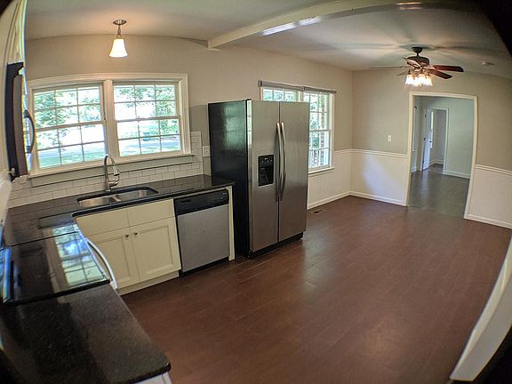 Kitchen & dining room lead to the living and bonus room