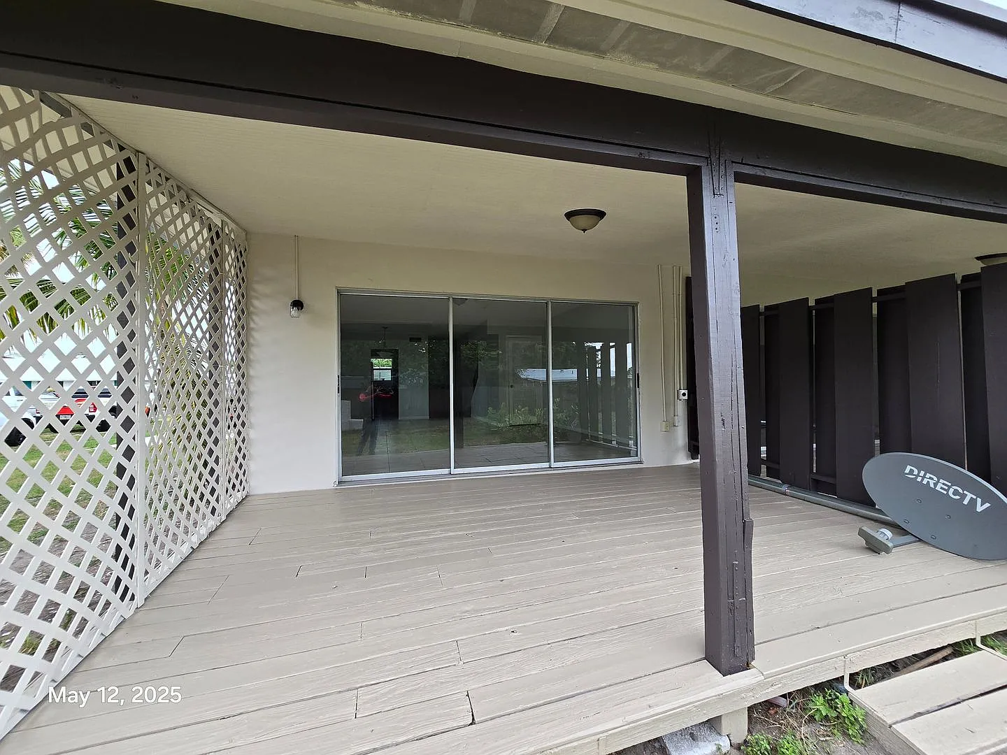 This renovated home provides modern convenience with a durable metal roof, impact-resistant windo... — Photo 2