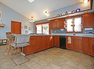 Kitchen has cathedral ceiling/skylight too