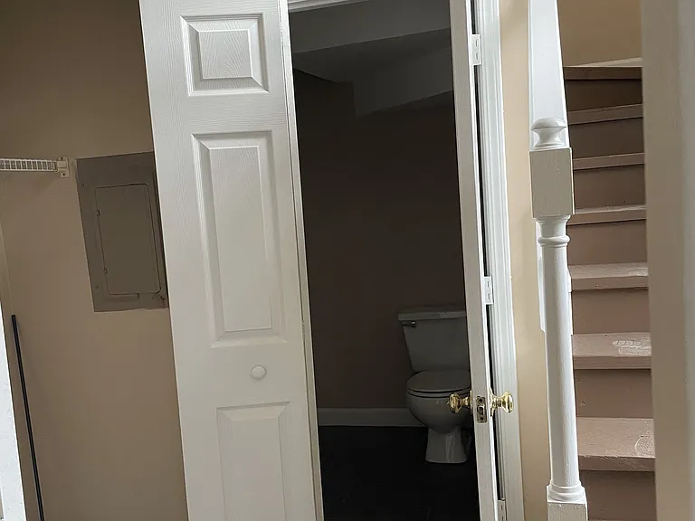 1/2 bath and laundry area off of living room
