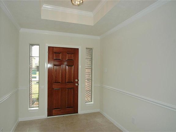 When you walk into this home, you notice elegant touches everywhere your look.  The entry has a raised ceiling, crown molding and chair rail.