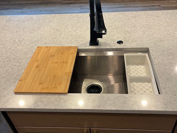 If you like to cook, you'll love this chefs kitchen, which includes this Kohler work station sink