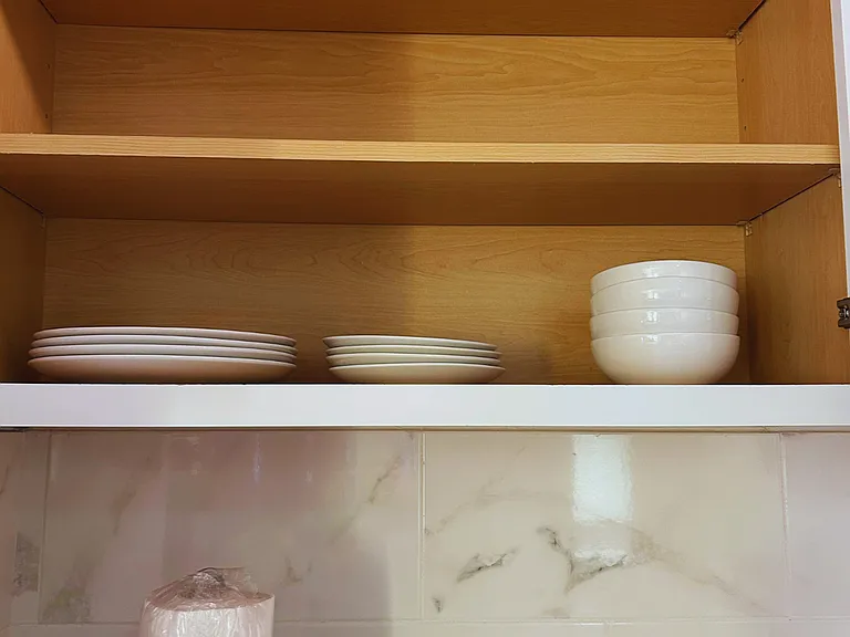 Complete dishware set with dinner plates, bowls, side plates, and mugs.