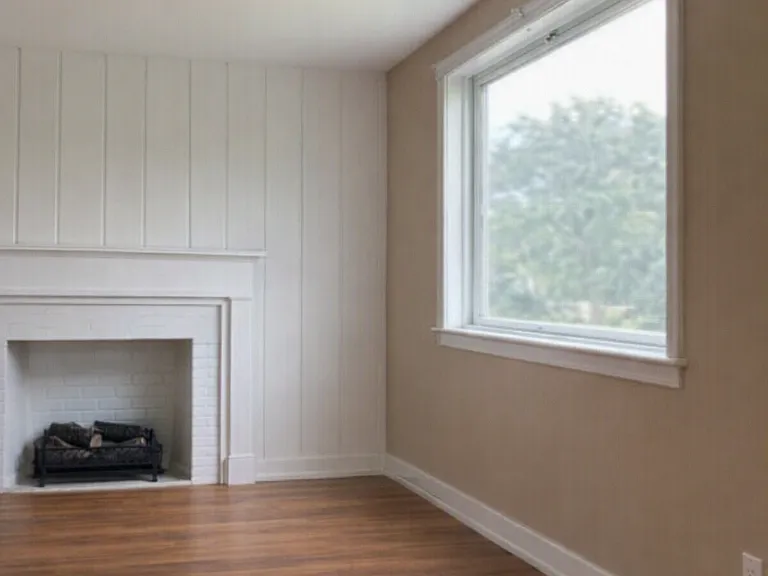 Hardwood floors, sunny front picture window, electric fireplace insert, freshly painted walls and ceilings throughout.