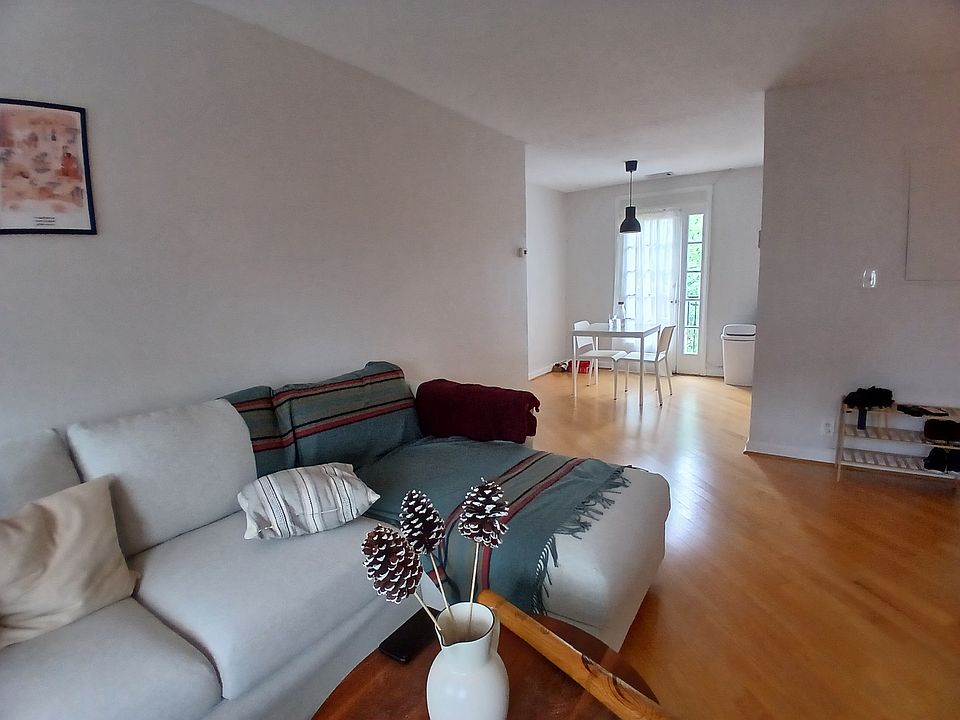 living room with an additional walk-in closet