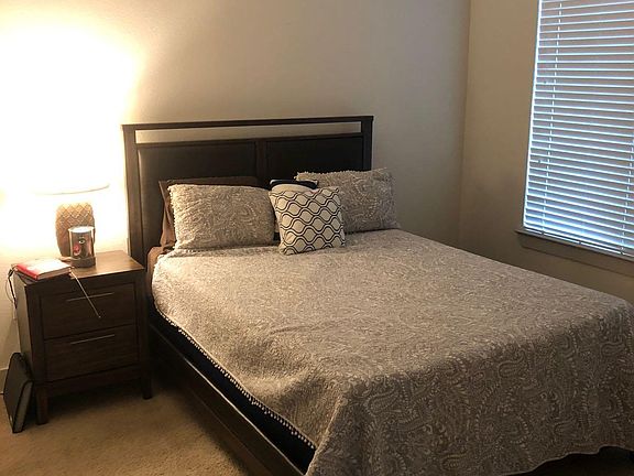 Bedroom with Ample Lighting