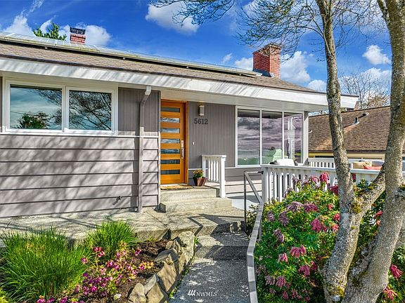 Professionally designed and landscaped yard is just one of the many great features of this home.