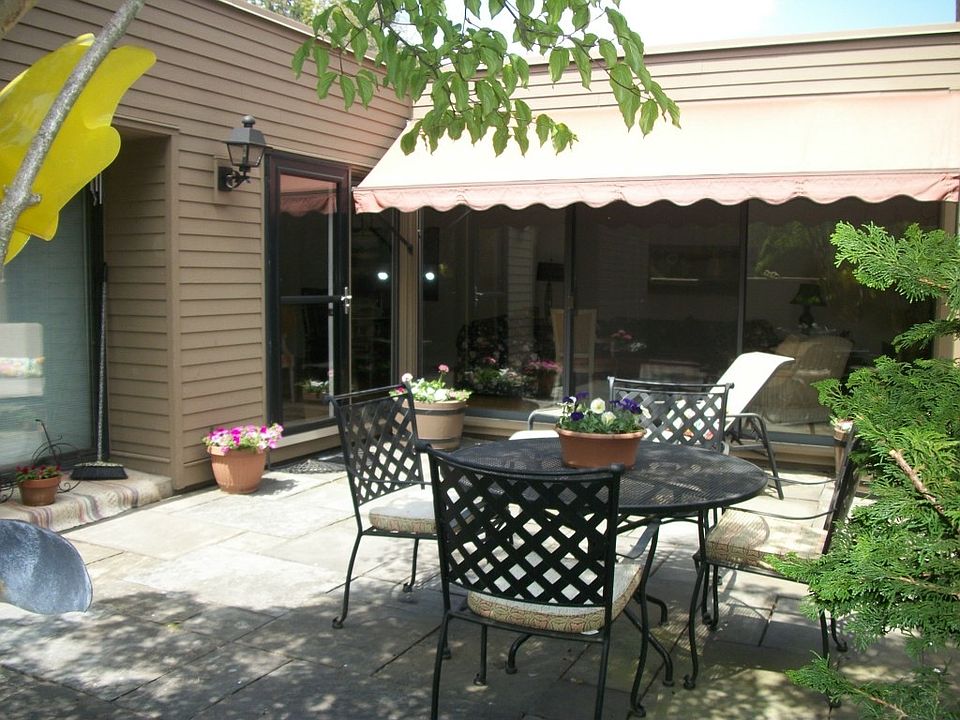 patio with view of awning over patio doors to living room