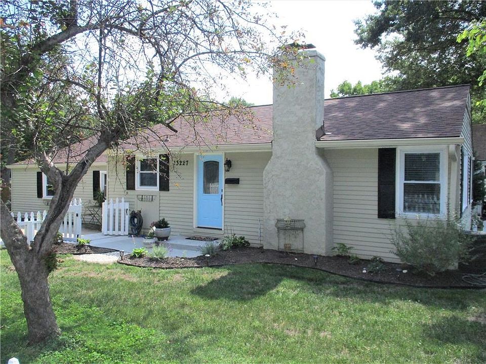 Everything has been updated in this darling ranch located in downtown Lenexa.