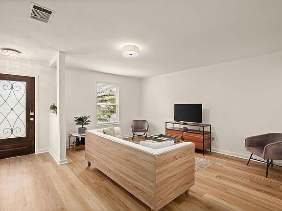 Front door and living room - not pictured is another love seat we have added