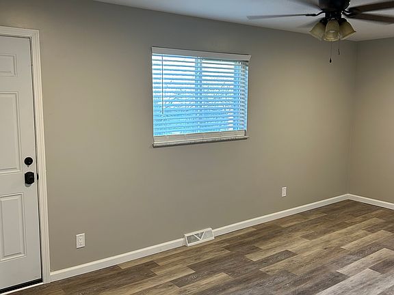 Large living room that goes off to the balcony. Has ceiling fan as well!