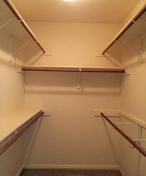 LARGE walk in Master closet w/ upper and lower shelves