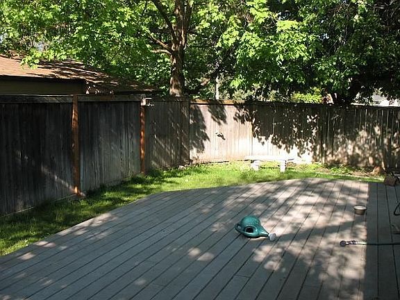 Private and quiet back yard, fenced, with in ground sprinkler systems, lattice