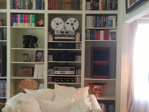 Floor to ceiling book/stereo shelves