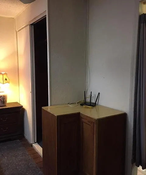 THIS IS THE INTERNET HOOK- UP ON A CORNER CABINET IN THE BEDROOM THAT CAN SERVE AS A COMPUTER DESK WHERE YOU CAN PLUG IN YOUR COMPUTER TO THE ROUTER OR JUST GO ON LINE FROM ANY WHERE IN THE APT WIFI.