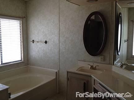Master Bath with Garden Tub : and stand alone shower, vanity and dual sinks with new faucets.