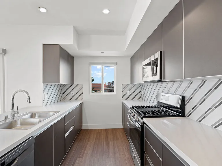 Kitchen with Energy-Efficient Stove, Dishwasher, and Microwave Oven
