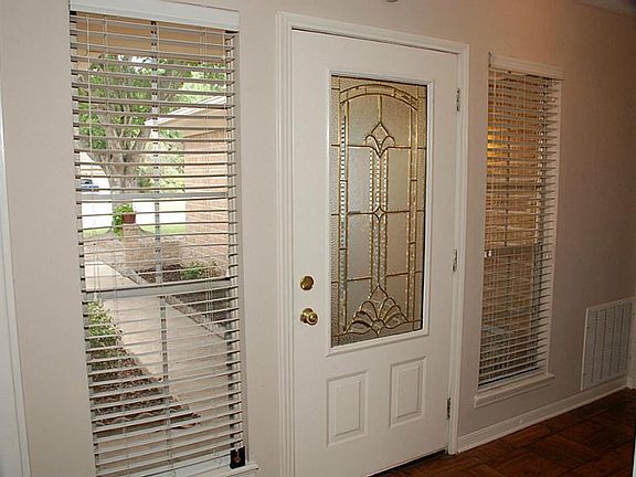With sidelights on both sides of the beautiful door, there's plenty of light in the foyer.