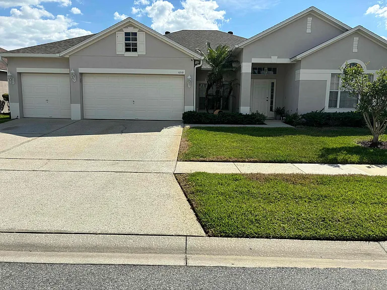 Front view of house showcasing beautiful curb appeal with 3-car garage