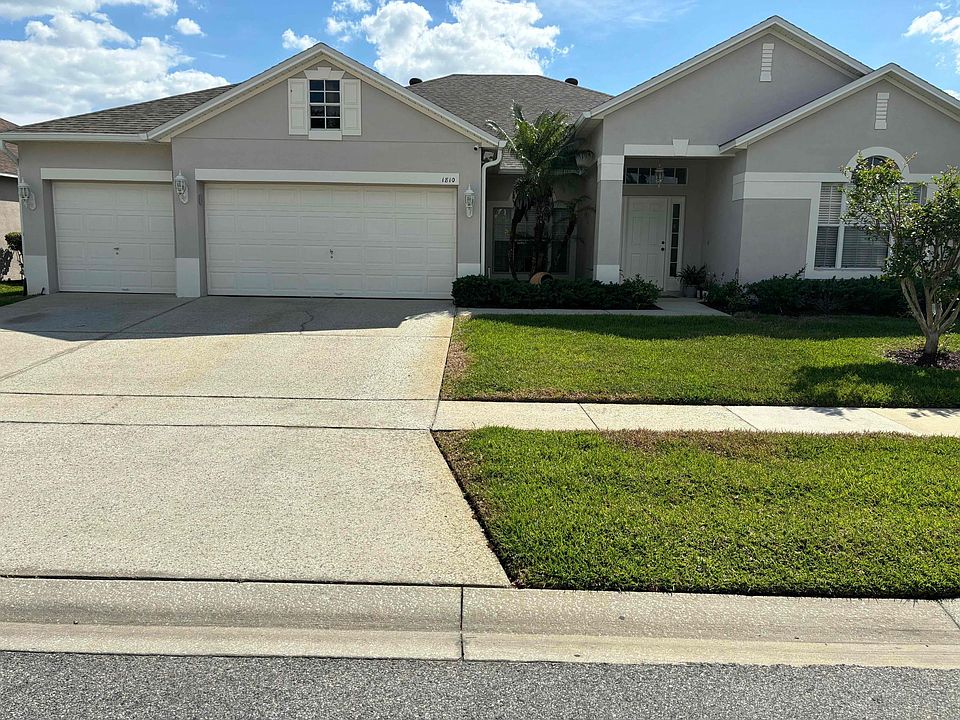 Front view of house showcasing beautiful curb appeal with 3-car garage
