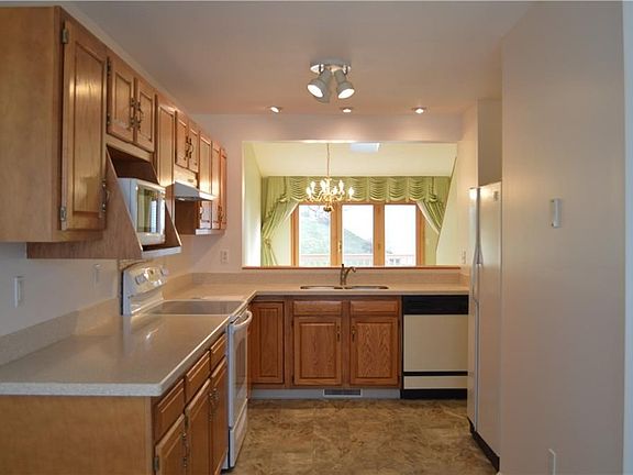 Kitchen opens up into the living room-dining room combo, creating a nice flow in the space!