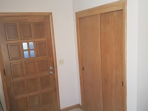 Entrance with walk in closet.