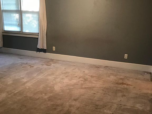 Master bedroom. Carpet removed, new laminate flooring.