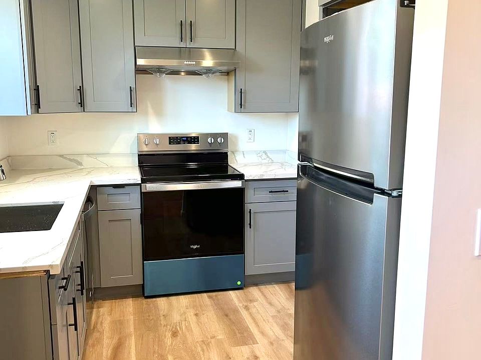 BRAND-NEW kitchen with NEW quartz countertops, NEW shaker cabinets, NEW Whirlpool stainless-steel appliances.