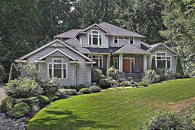 Nestled on a a gorgeous wooded acre in Cedarwood Estates gated neighborhood 