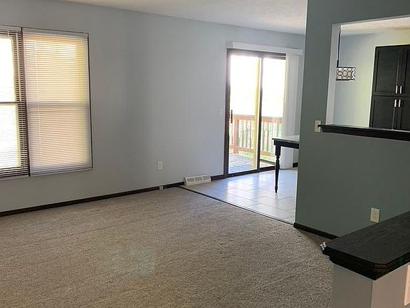 large family room witch leads into the kitchen and deck
