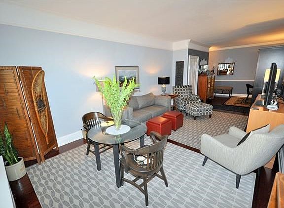 The living room and dining foyer have been opened to create a massive space.  The living room has a cove ceiling, picture molding and refinished hardwood floors.  The living room is 23'-6"  x 12'-6" and the dining foyer is 15'-0" x 8'-0".