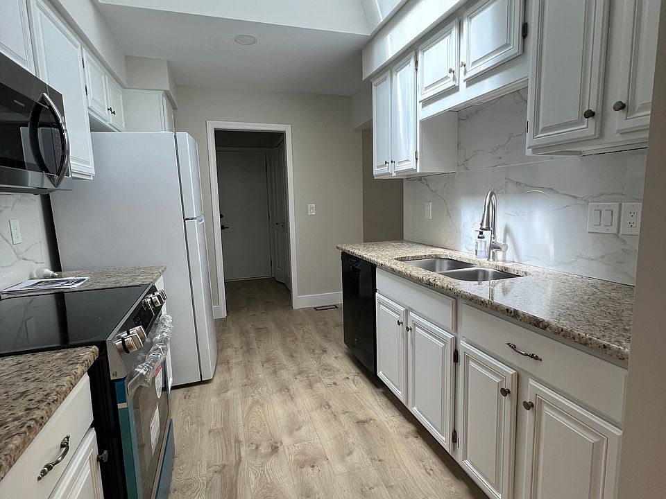 Kitchen gets a lot of light from the skylight.