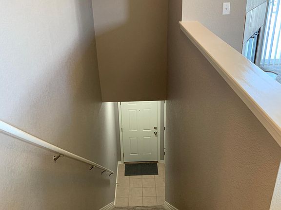 View from top of stairs to main entrance on ground floor