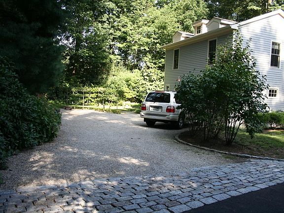 Additional parking in front of pear trees