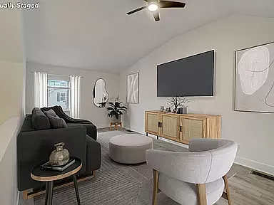 loft overlooking stairs 
with cathedral ceiling, ceiling fan, closet and window (3rd bedroom?)