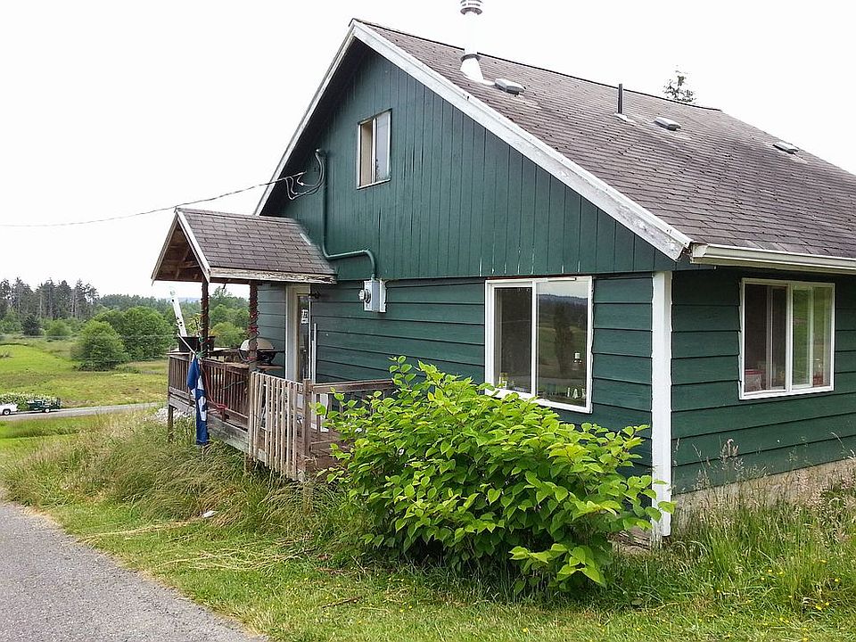 Side of home by driveway