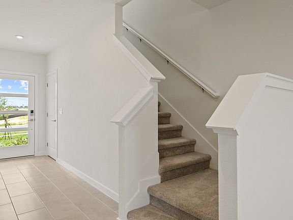 Welcoming entryway in the Ponte Vedra home with sleek flooring, recessed lighting, and a clean and m