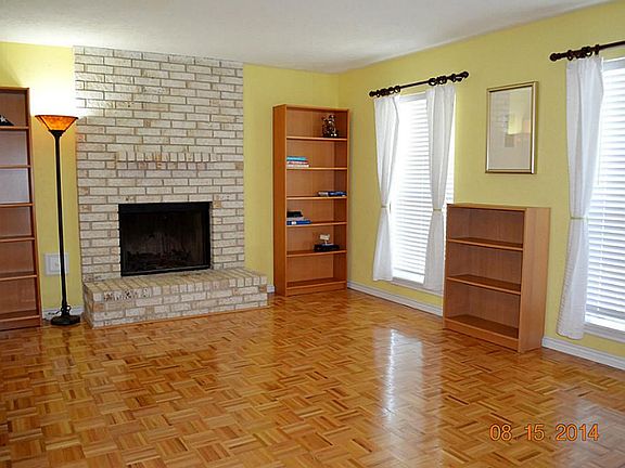 FAMILY/GAMEROOM ROOM WITH WOOD FLOORS & FIREPLACE