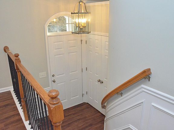 Entry Landing with Vaulted Ceiling and Coat Closet